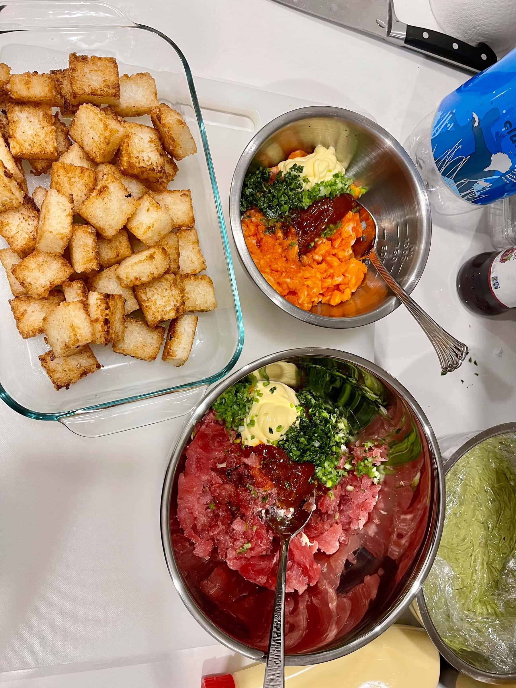 Kitchen prep station with croutons, dressings, and tartare